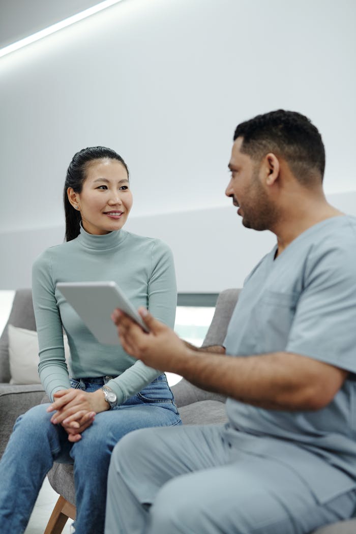 Healthcare professional and patient discussing treatment options in a modern clinic setting.